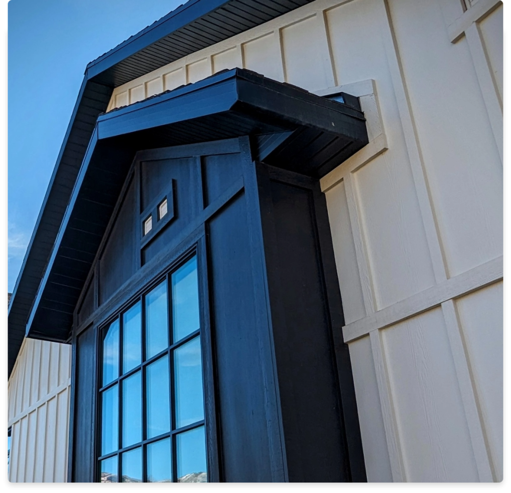 Board and Batten Siding, an image of part of a house with darker and lighter siding