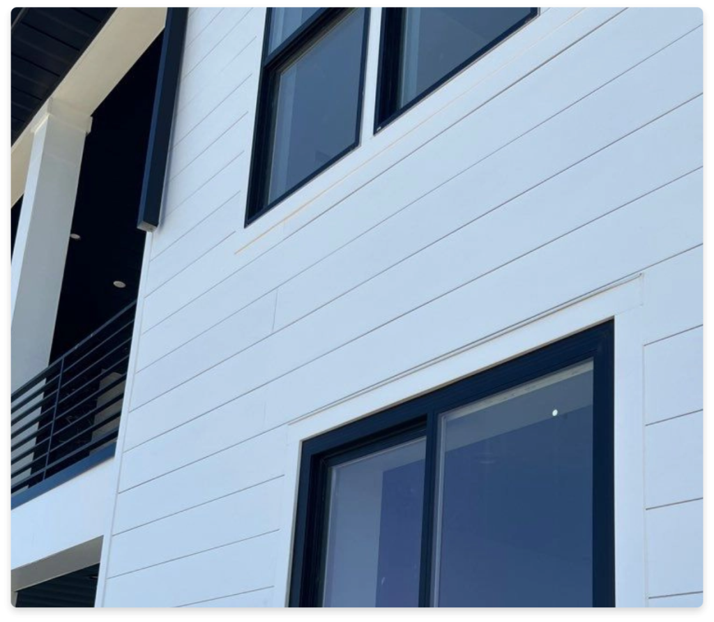 Conquest Siding, image of part of a structure with white siding