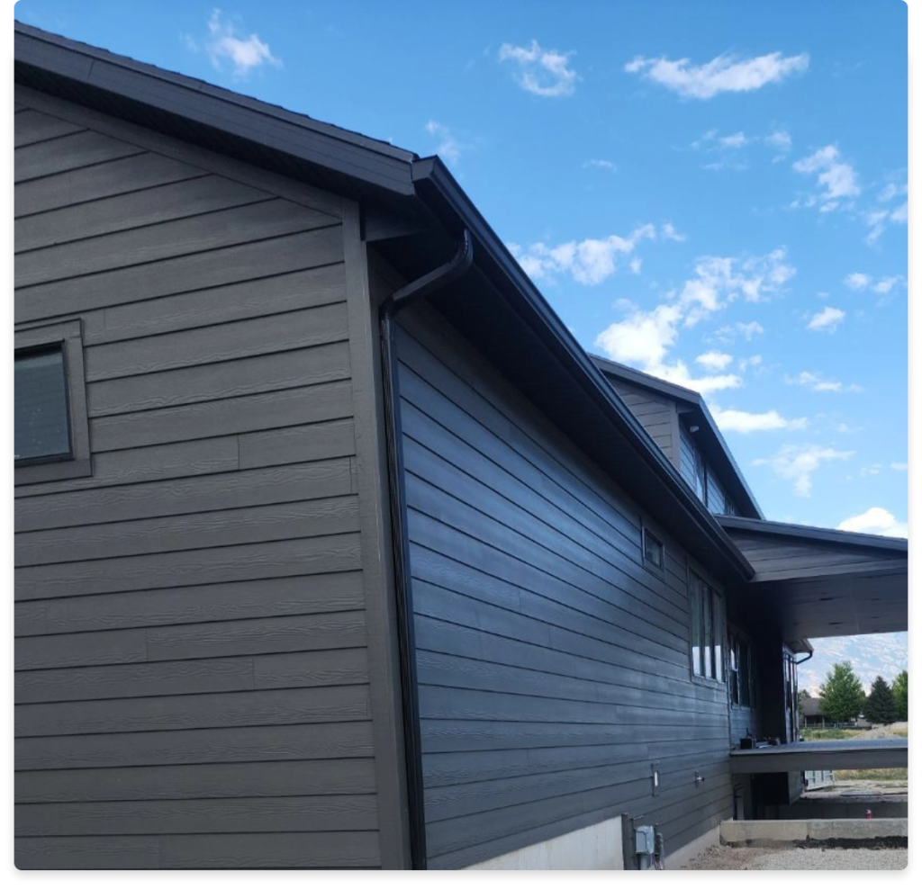 Odyssey Siding image, part of a house with gray siding